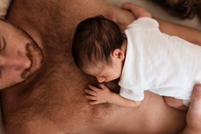 close-up-father-holding-baby-his-chest.jpg